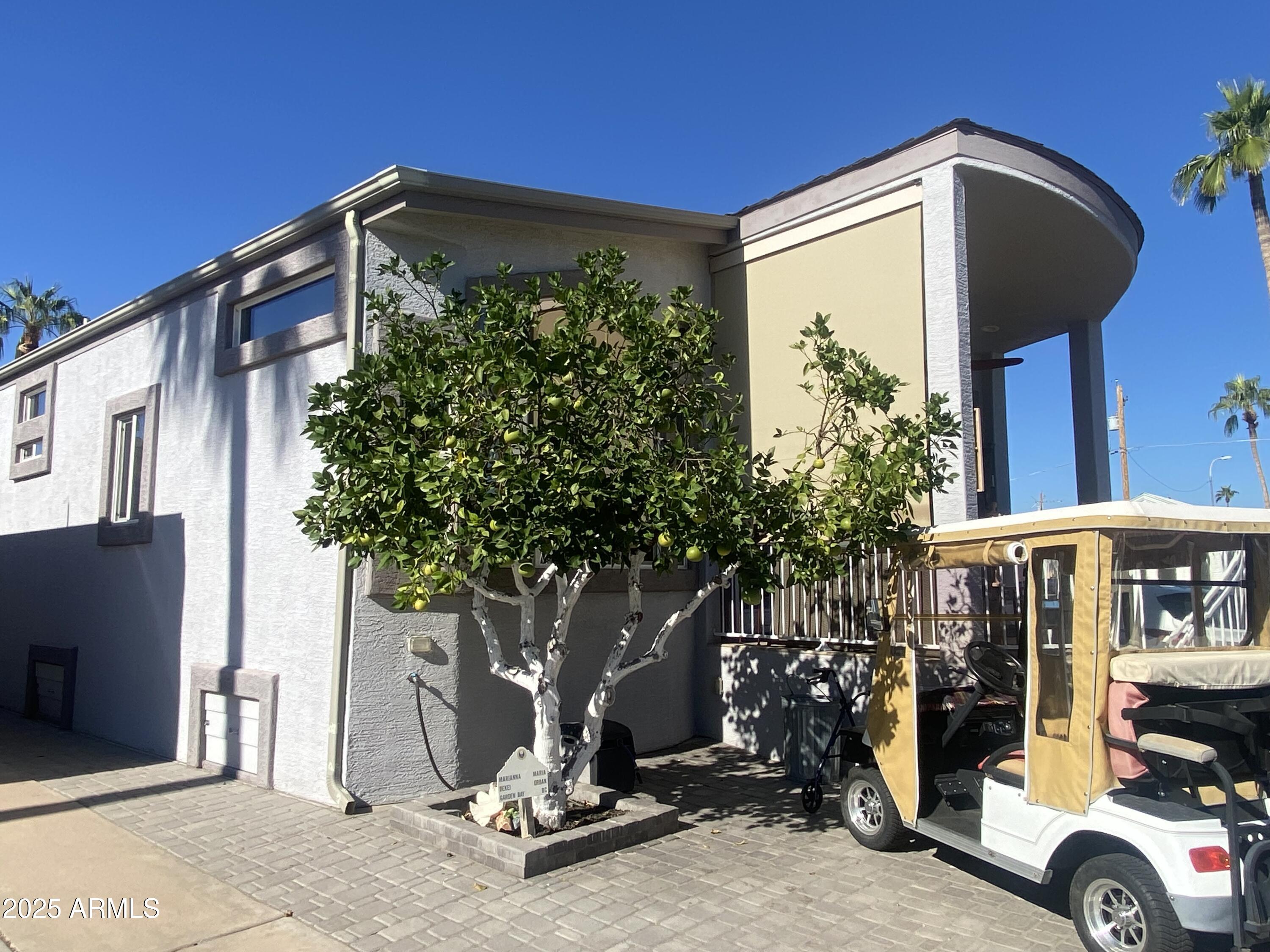 1279 South Sioux Drive Apache Junction, AZ 85119 - Photo 33 of 34 a car parked in front of a building