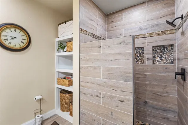 a bedroom with a bed and a desk