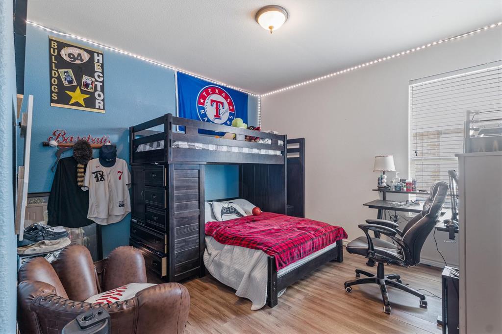 503 Sundrop Lane Fate, TX 75087 - Photo 20 of 28 a living room with furniture and a flat screen tv