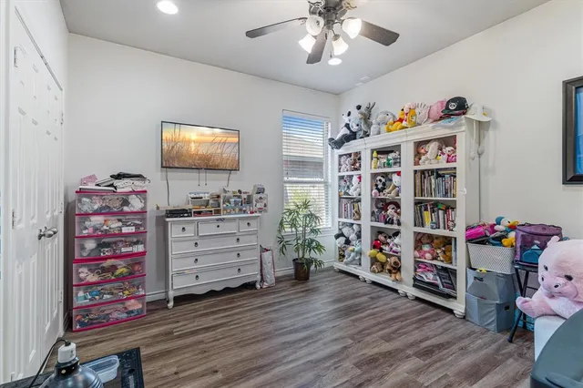 a view of a porch with furniture and a yard