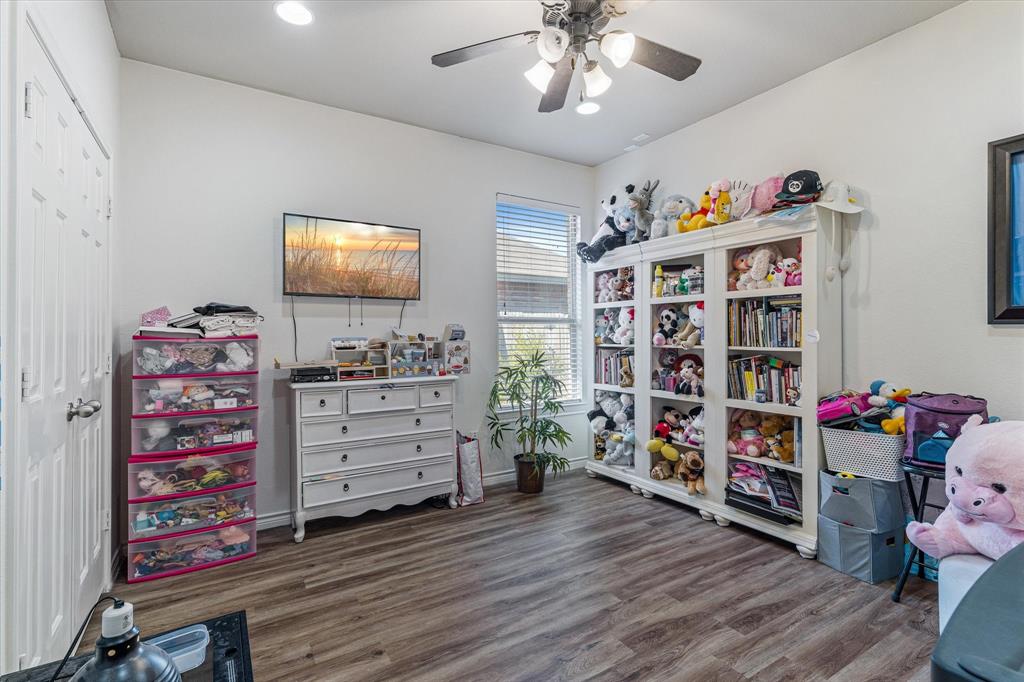 503 Sundrop Lane Fate, TX 75087 - Photo 21 of 28 a room with furniture and wooden floor