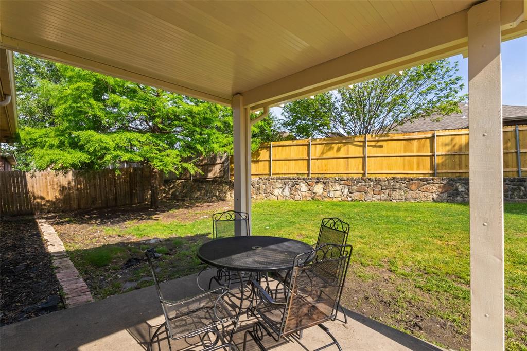 503 Sundrop Lane Fate, TX 75087 - Photo 22 of 28 a view of a porch with furniture and a yard