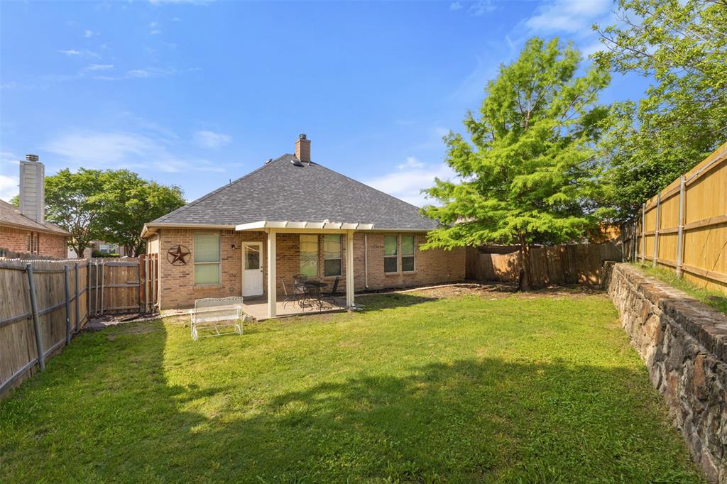 503 Sundrop Lane Fate, TX 75087 - Photo 23 of 28 a front view of a house with a yard