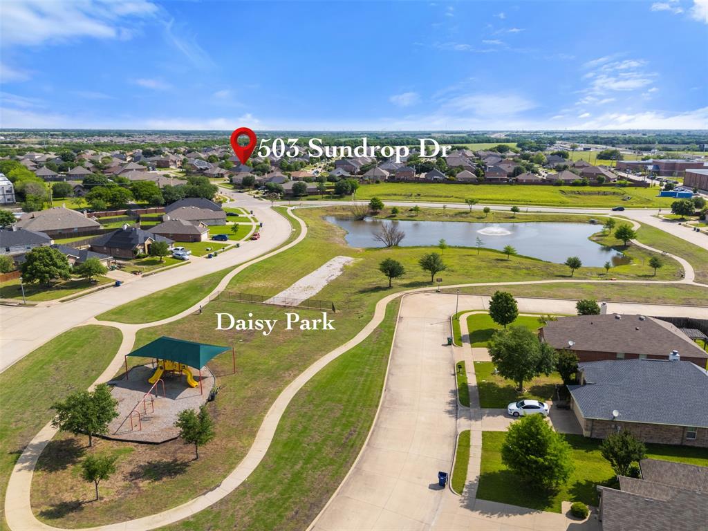 503 Sundrop Lane Fate, TX 75087 - Photo 24 of 28 a view of a swimming pool with a table and chairs