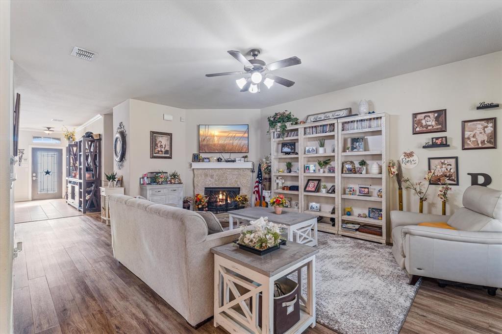 503 Sundrop Lane Fate, TX 75087 - Photo 8 of 28 a living room with furniture and a flat screen tv