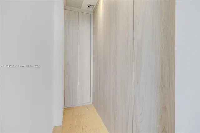 a view of a tall building next to a yard