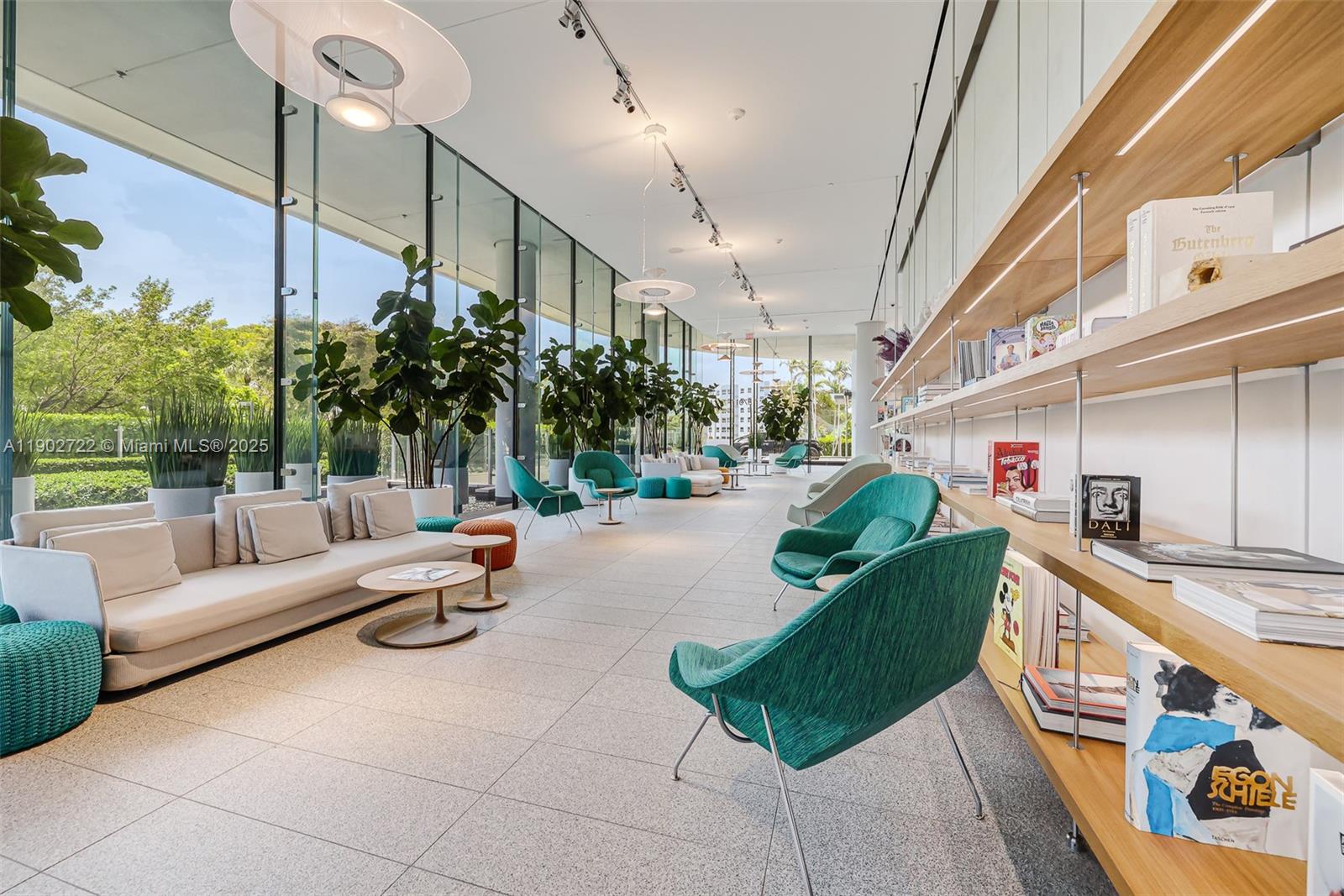 8701 Collins Avenue, Unit 904 Miami Beach, FL 33154 - Photo 46 of 73 a living room with furniture and a chandelier