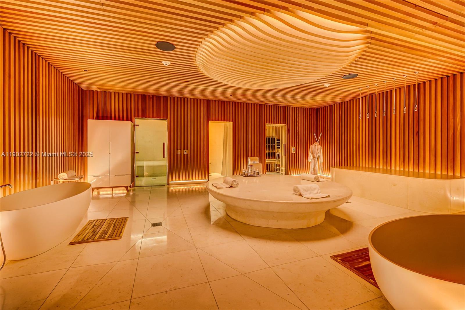 8701 Collins Avenue, Unit 904 Miami Beach, FL 33154 - Photo 48 of 73 a bathroom with a sink a bathtub and next to a window