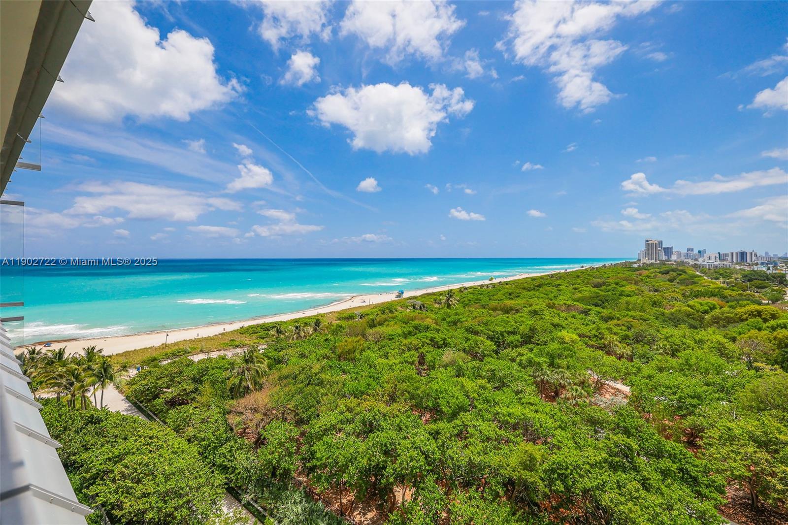 8701 Collins Avenue, Unit 904 Miami Beach, FL 33154 - Photo 59 of 73 a view of a big yard with an outdoor space and seating area