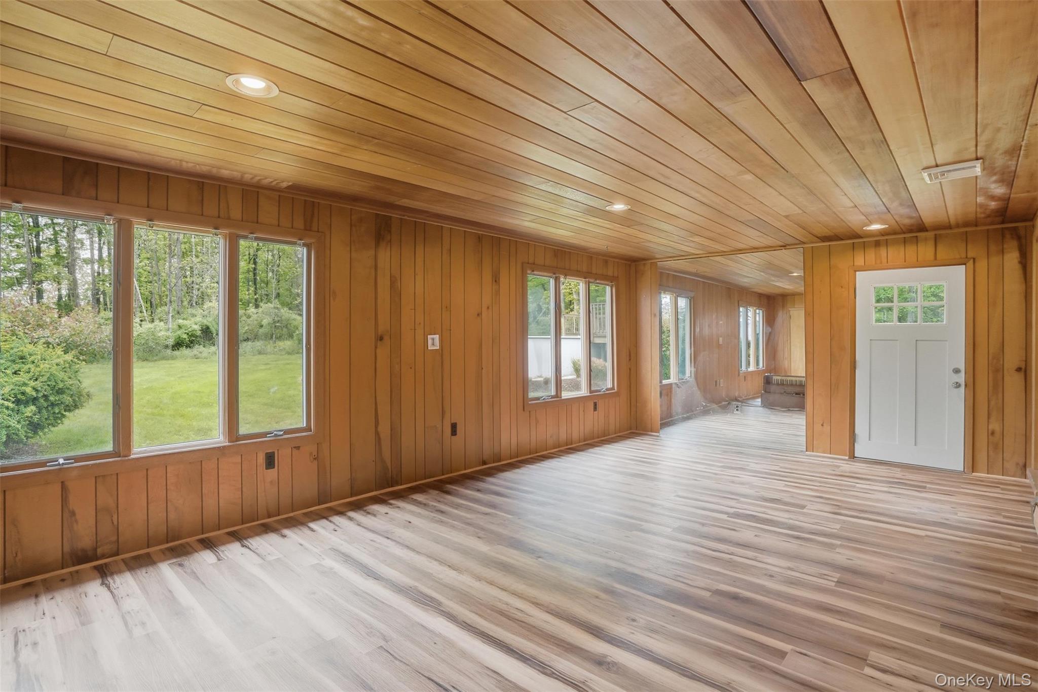 435 Samsonville Road Kerhonkson, NY 12446 - Photo 27 of 37 a view of an empty room with wooden floor and a window