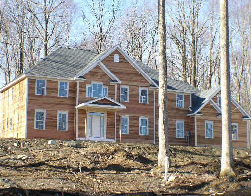 95 Winter Ridge Road Newtown, CT 06482 - Photo 1 of 1 a front view of a house with a yard