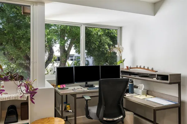 a view of a dining room with furniture window and outside view