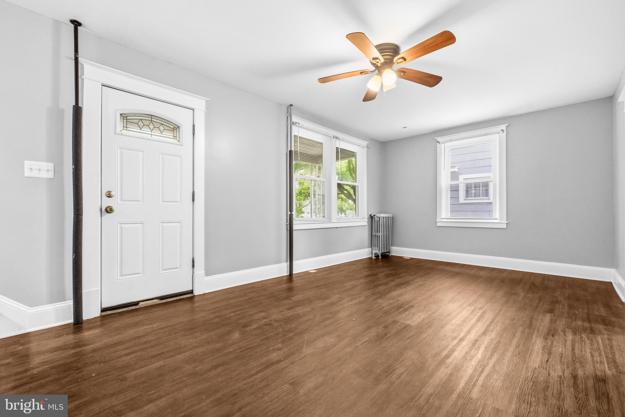 12 Leeway Dundalk, MD 21222 - Photo 6 of 34 an empty room with wooden floor and windows