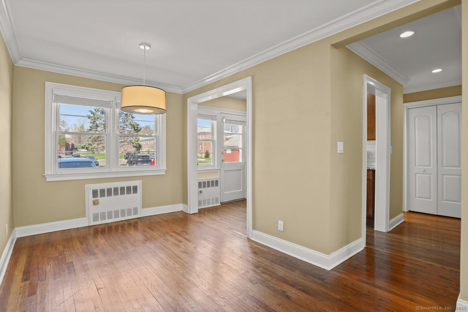 236 Glenbrook Road, Unit 13A Stamford, CT 06906 - Photo 4 of 14 a view of a room with wooden floor and window