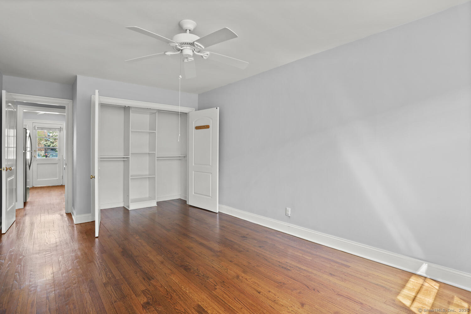 236 Glenbrook Road, Unit 13A Stamford, CT 06906 - Photo 10 of 14 wooden floor in an empty room with a window