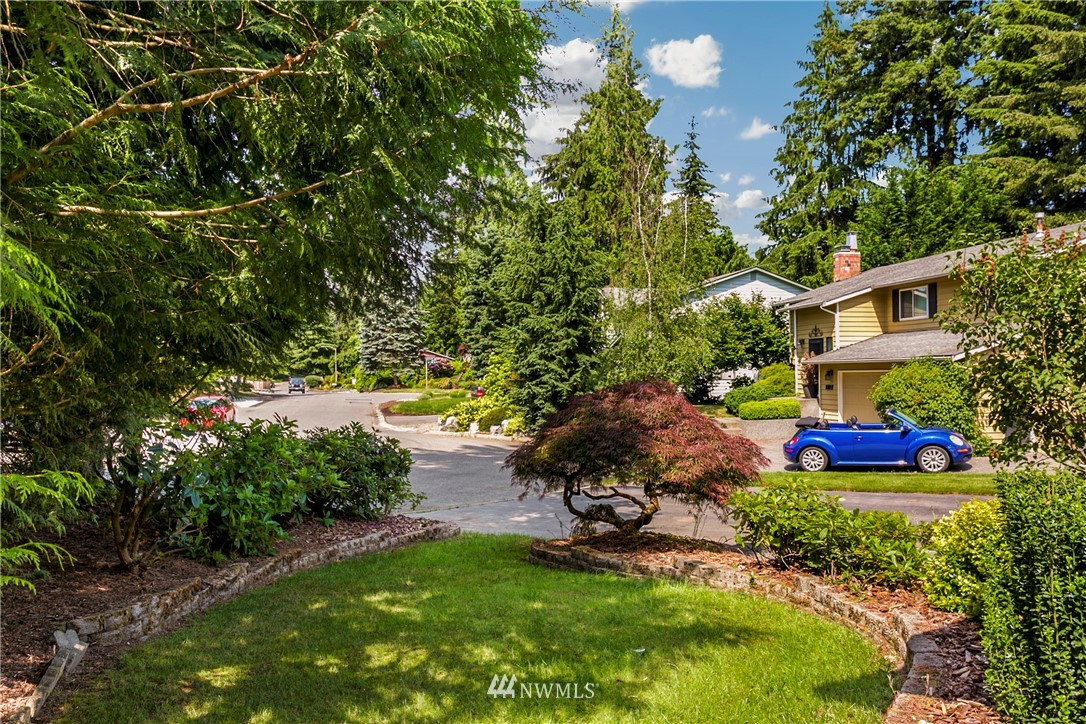 1823 175th Place Southeast Bothell, WA 98012 - Photo 2 of 24 a backyard of a house with yard and outdoor seating