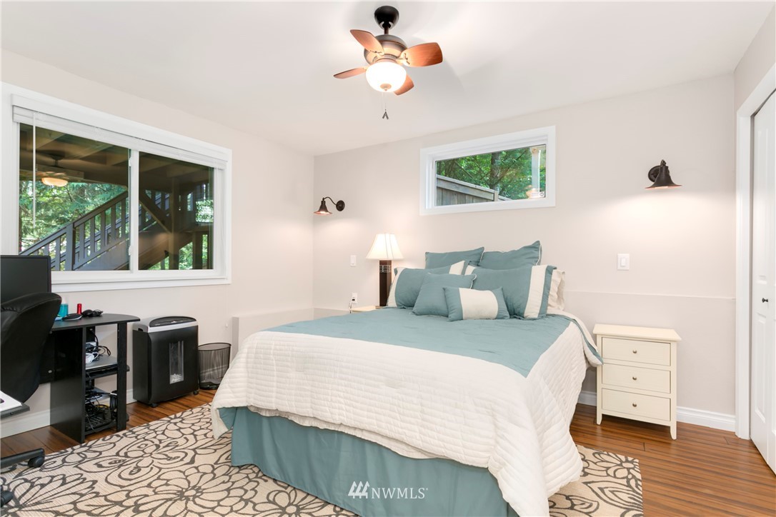 1823 175th Place Southeast Bothell, WA 98012 - Photo 12 of 24 a bedroom with a bed and wooden floor