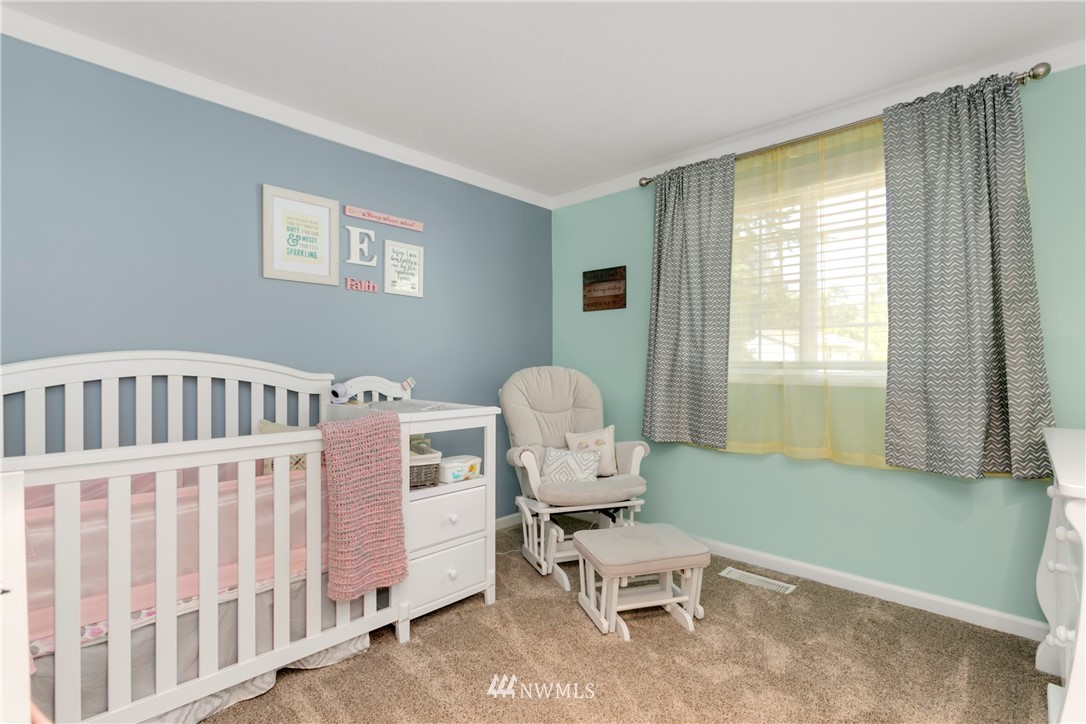 1823 175th Place Southeast Bothell, WA 98012 - Photo 15 of 24 a bedroom with furniture and a window