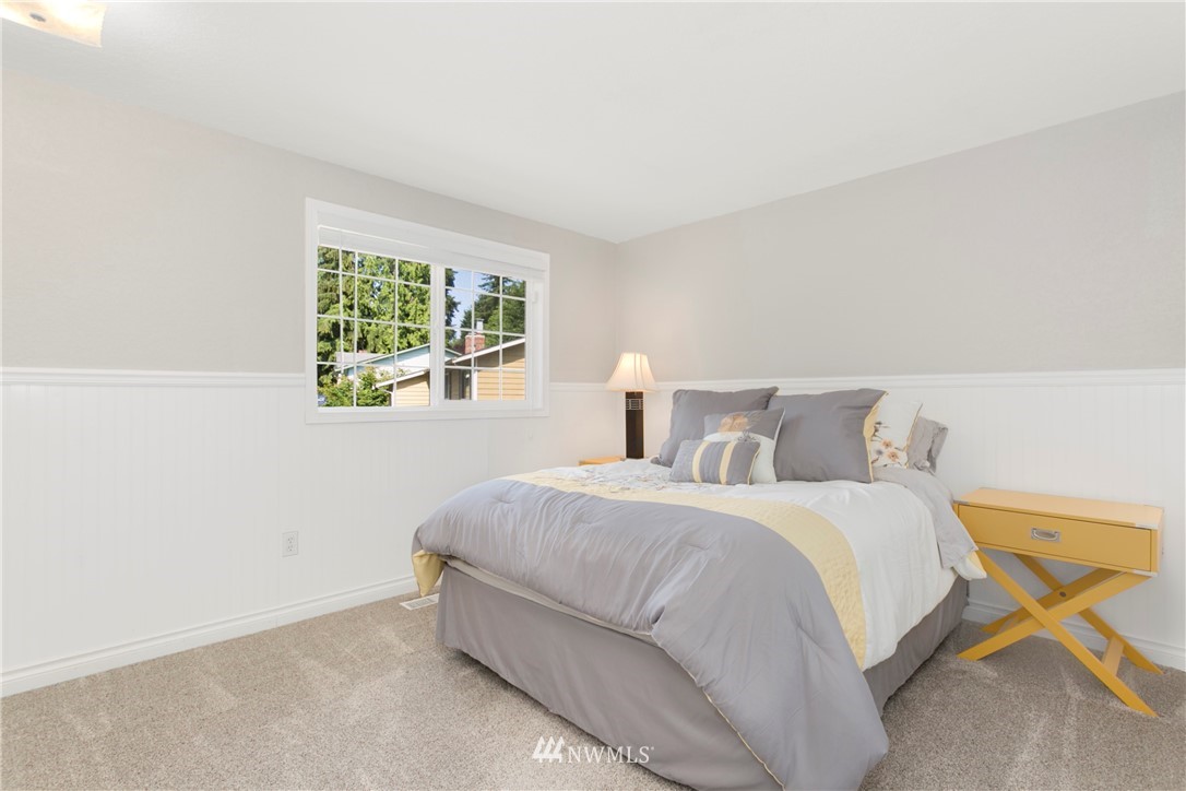 1823 175th Place Southeast Bothell, WA 98012 - Photo 16 of 24 a bedroom with a bed and a window