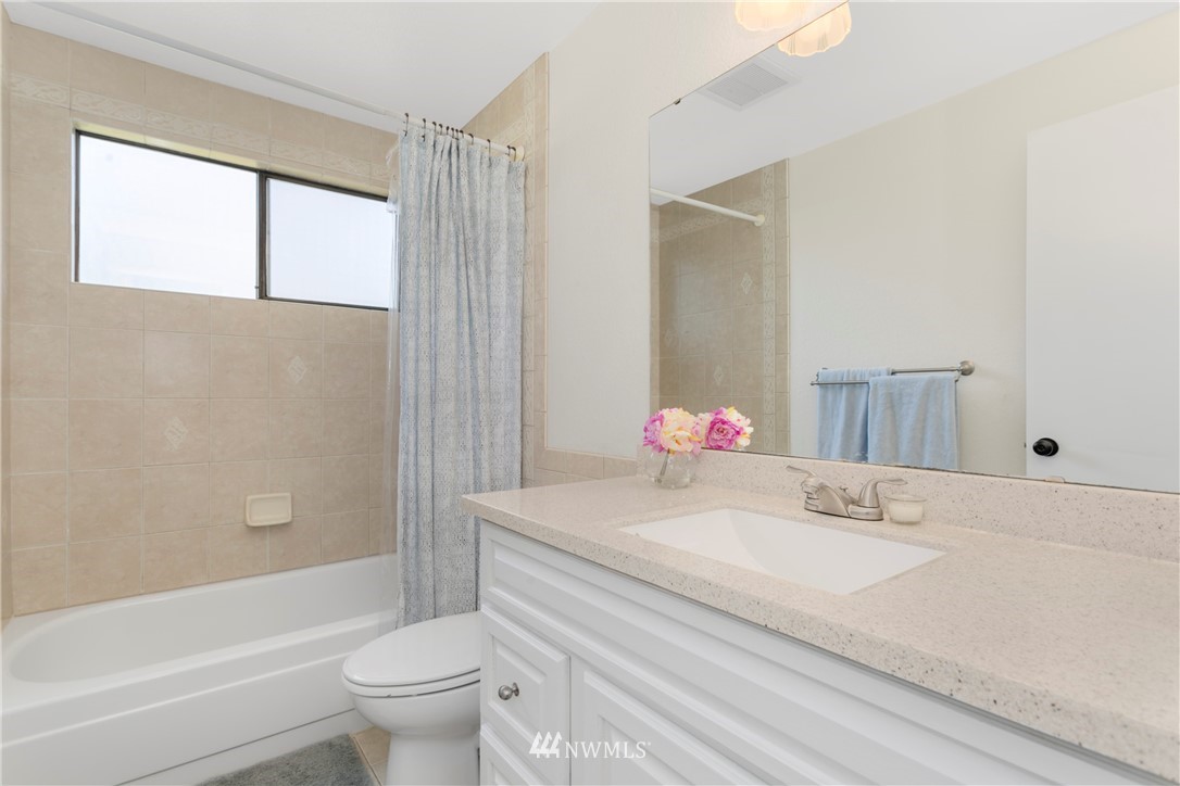 1823 175th Place Southeast Bothell, WA 98012 - Photo 17 of 24 a bathroom with a sink toilet and shower