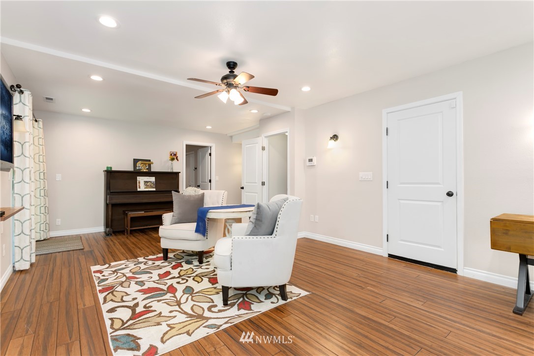 1823 175th Place Southeast Bothell, WA 98012 - Photo 19 of 24 a living room with furniture and wooden floor