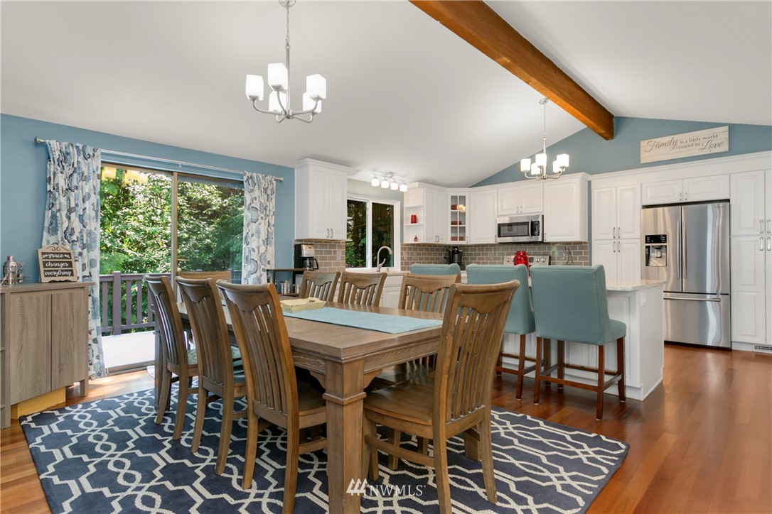 1823 175th Place Southeast Bothell, WA 98012 - Photo 7 of 24 a view of a dining room with furniture window and wooden floor