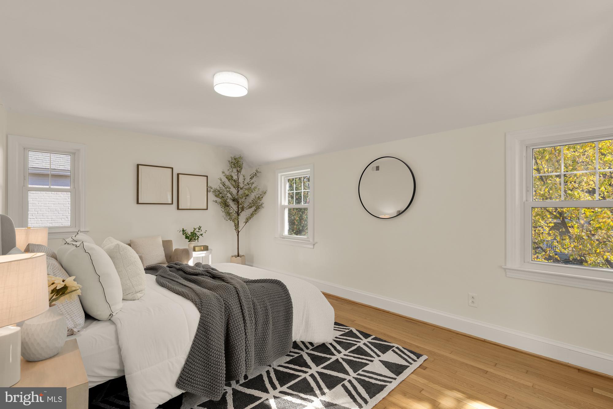 4701 Rosedale Avenue Bethesda, MD 20814 - Photo 16 of 43 a bedroom with bed and wooden floor