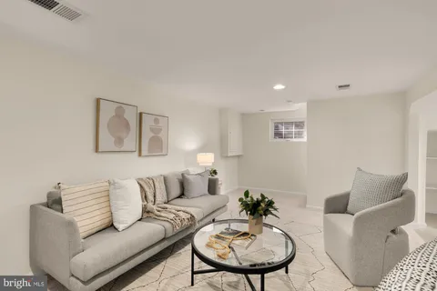 a living room with furniture and a table