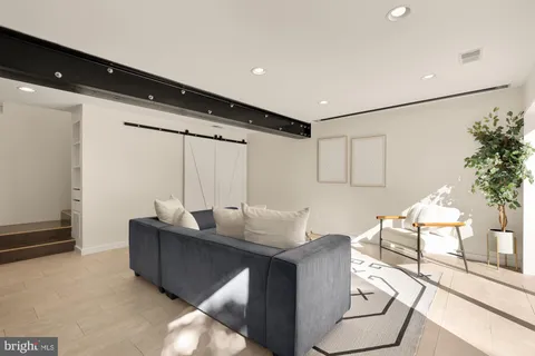 a living room with furniture and a table