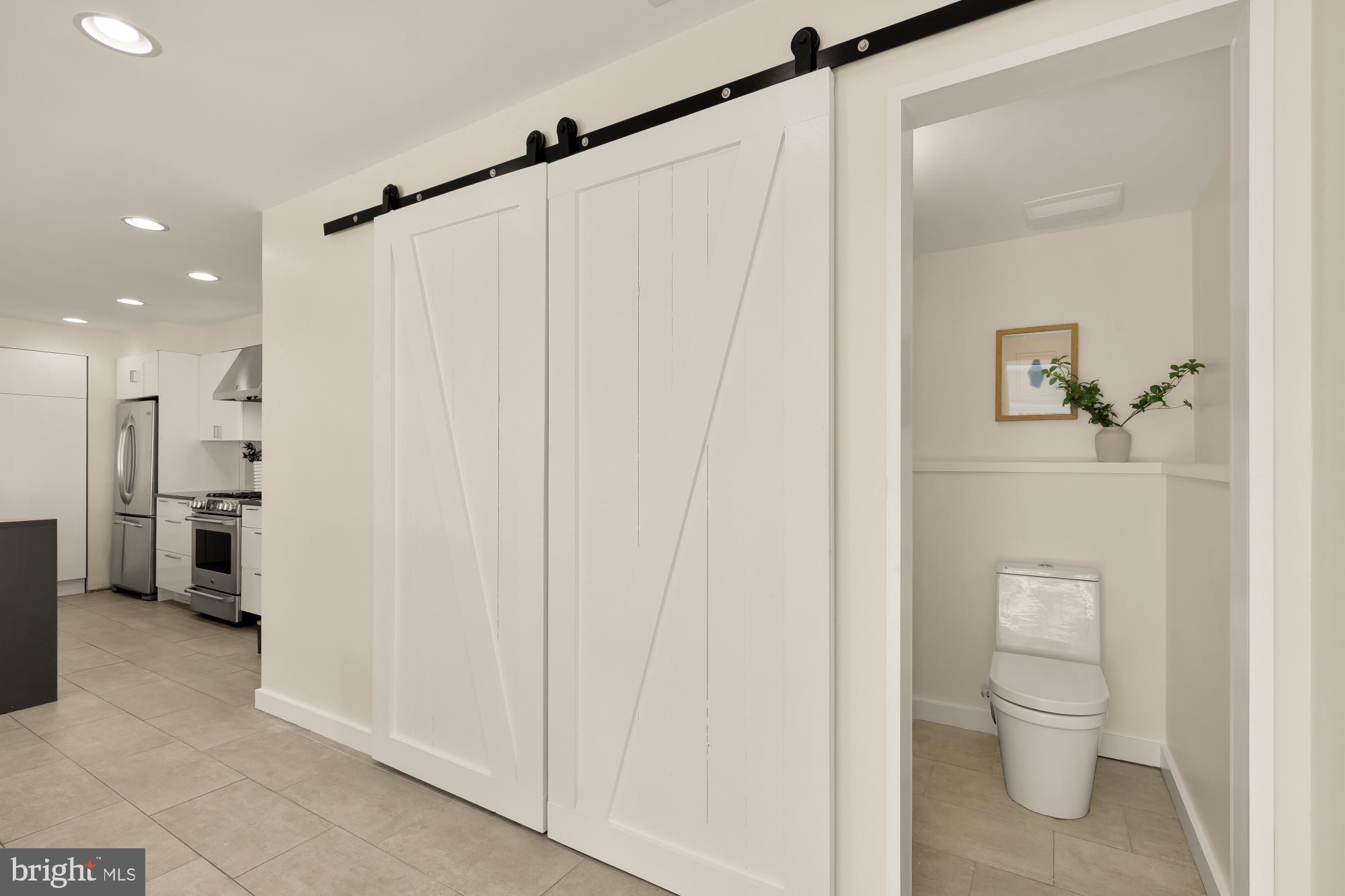 4701 Rosedale Avenue Bethesda, MD 20814 - Photo 33 of 43 a bathroom with a shower a toilet and a sink