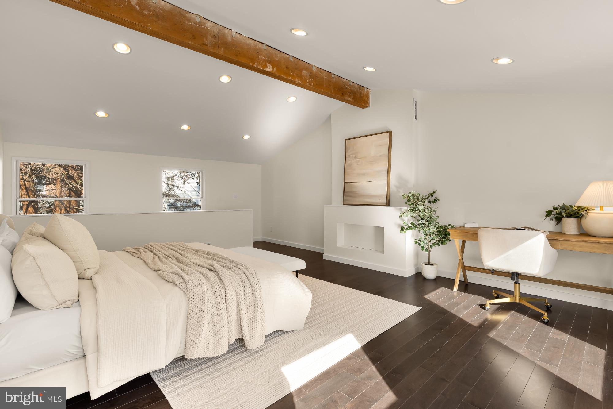 4701 Rosedale Avenue Bethesda, MD 20814 - Photo 35 of 43 a spacious bedroom with a bed and a lamp