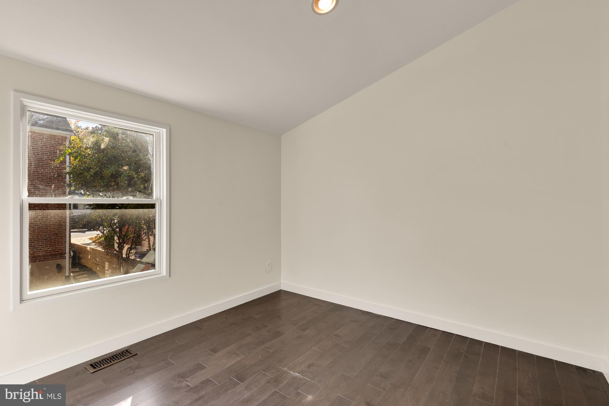 4701 Rosedale Avenue Bethesda, MD 20814 - Photo 36 of 43 a view of an empty room with a window