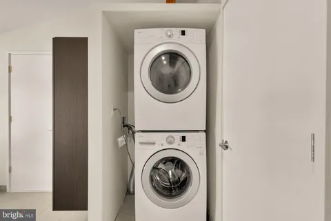 a white bath tub sitting next to a white toilet