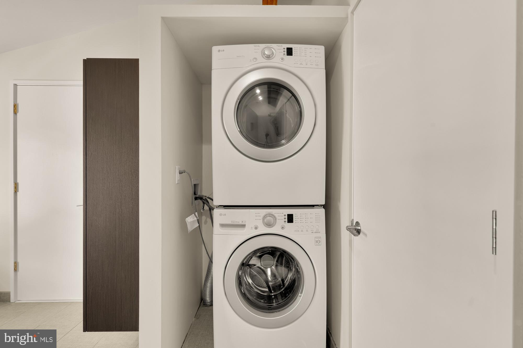 4701 Rosedale Avenue Bethesda, MD 20814 - Photo 38 of 43 a utility room with dryer and washer
