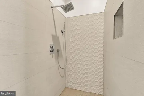 a picture of a wall with a white building