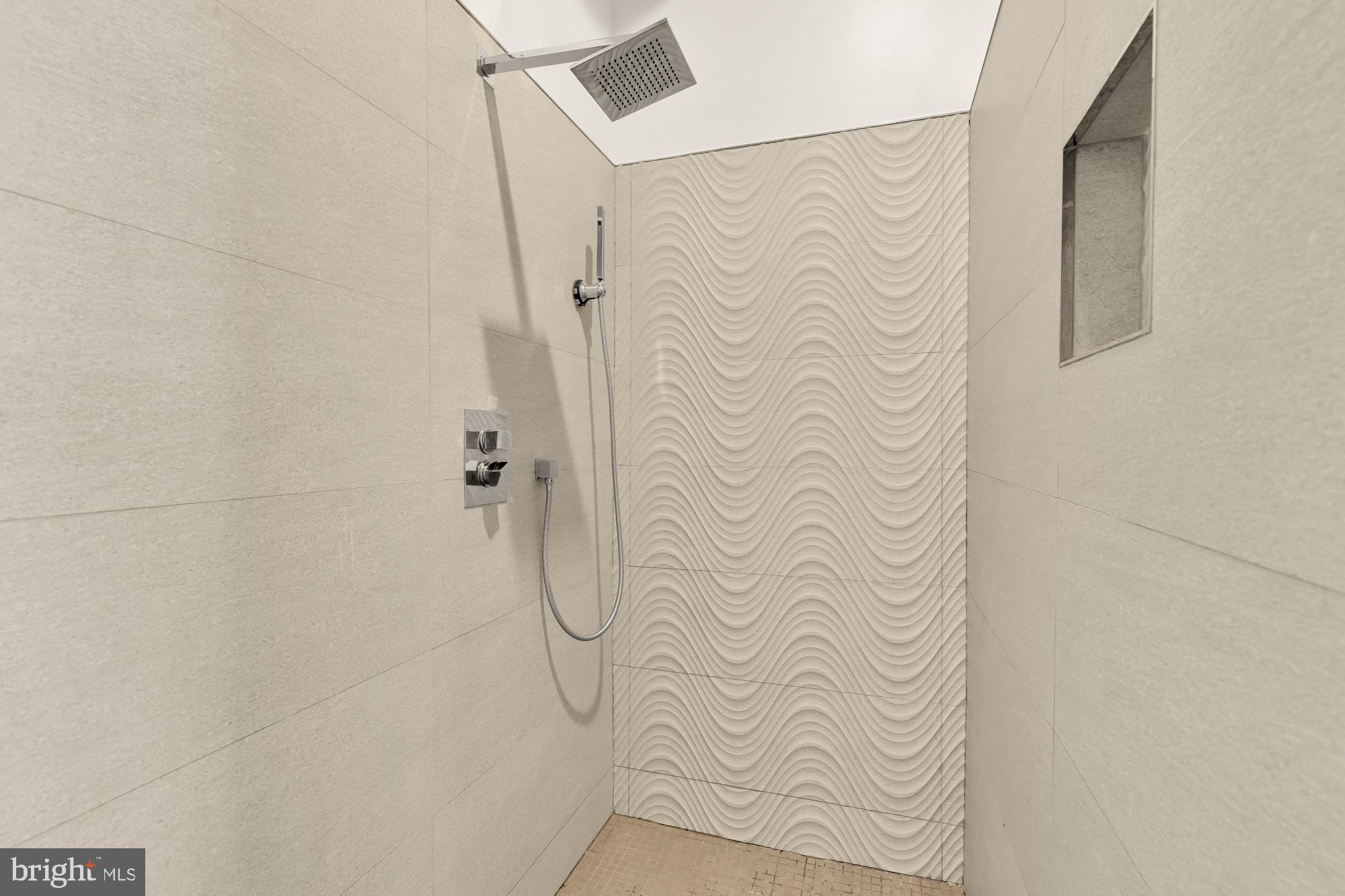 4701 Rosedale Avenue Bethesda, MD 20814 - Photo 41 of 43 a bathroom with a shower curtain and a shower curtain