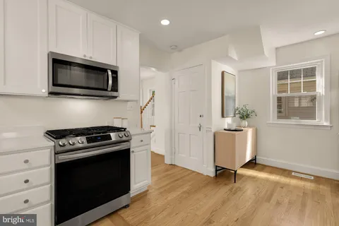 a kitchen with a stove and a microwave