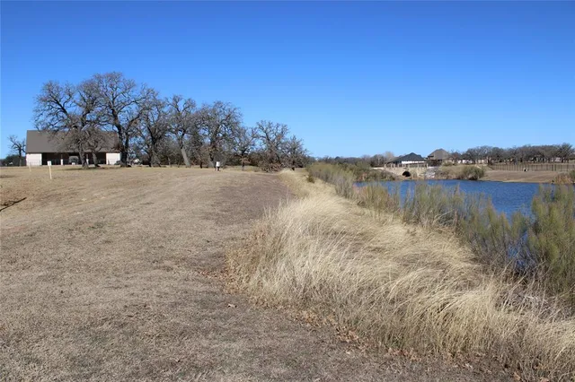a kitchen with stainless steel appliances wooden cabinets and a refrigerator