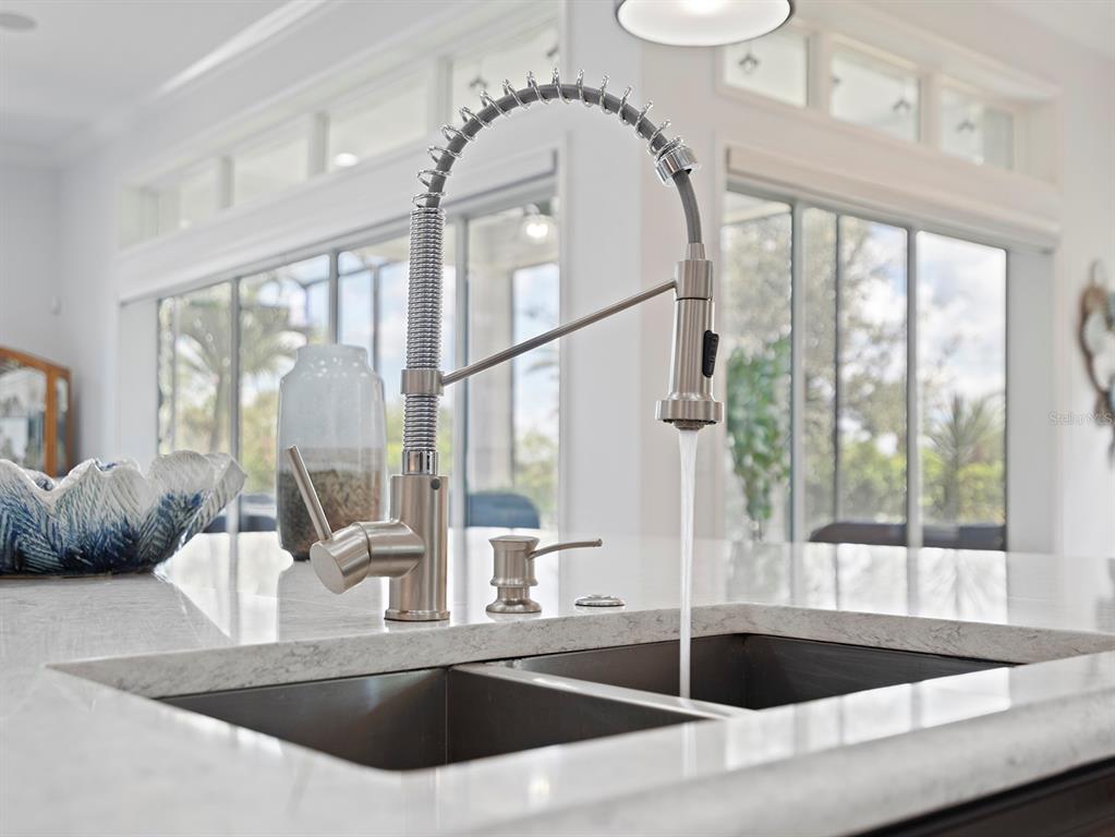 2600 Meadowedge Loop St. Cloud, FL 34772 - Photo 22 of 82 a kitchen with a large window and a sink