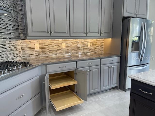 2600 Meadowedge Loop St. Cloud, FL 34772 - Photo 24 of 82 a kitchen with granite countertop a stove a refrigerator and a sink