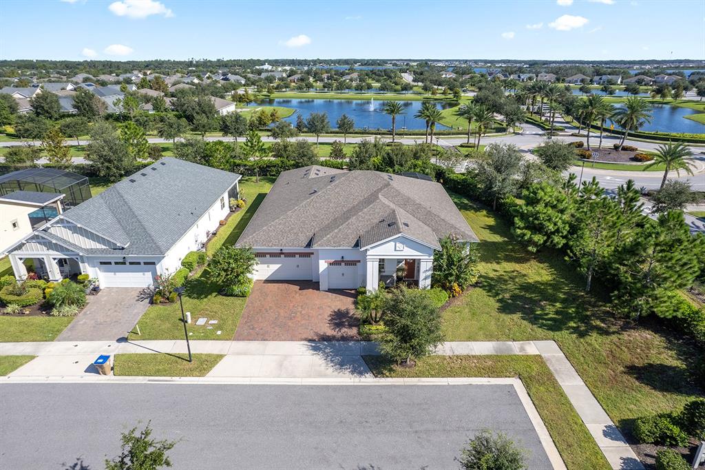 2600 Meadowedge Loop St. Cloud, FL 34772 - Photo 3 of 82 an aerial view of a house with a garden