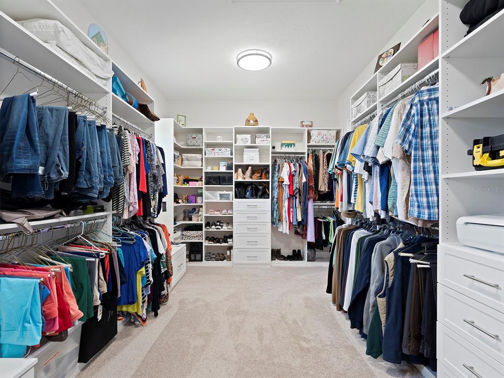2600 Meadowedge Loop St. Cloud, FL 34772 - Photo 43 of 82 a view of walk in closet with clothes and shoes