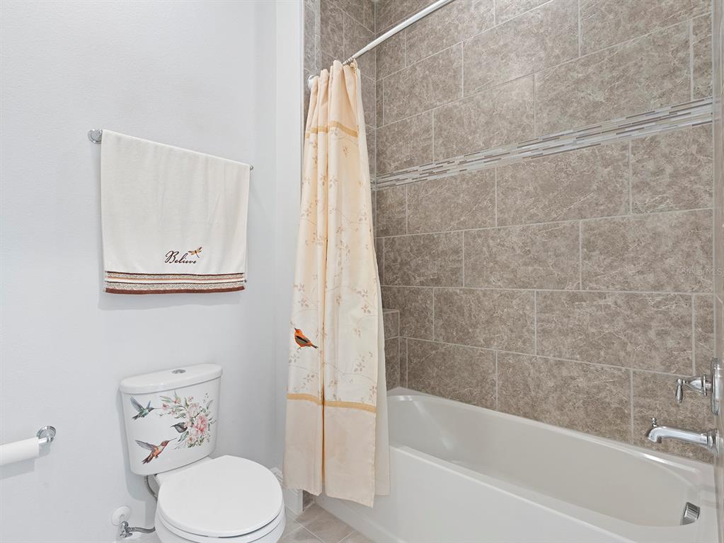 2600 Meadowedge Loop St. Cloud, FL 34772 - Photo 50 of 82 a bathroom with a toilet and a bathtub
