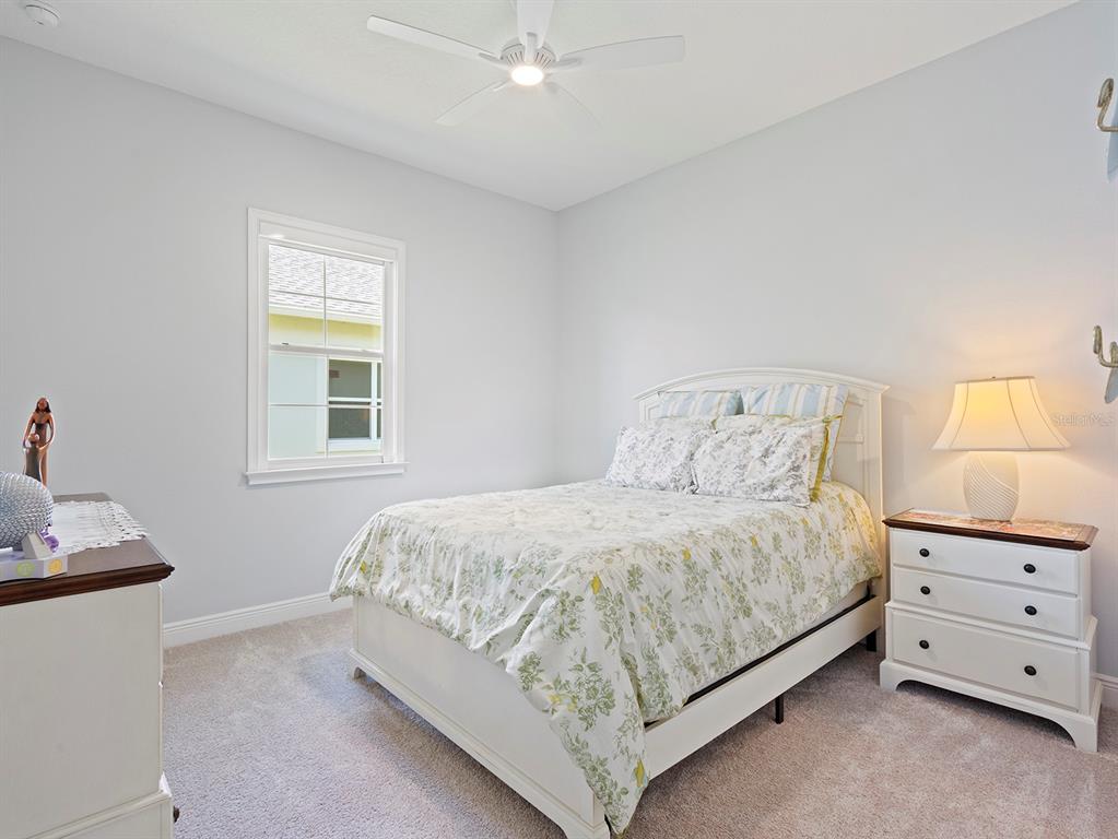 2600 Meadowedge Loop St. Cloud, FL 34772 - Photo 51 of 82 a bedroom with a bed and window