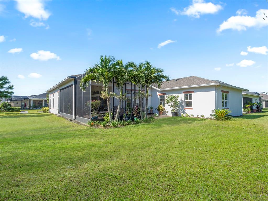 2600 Meadowedge Loop St. Cloud, FL 34772 - Photo 60 of 82 a front view of a house with garden