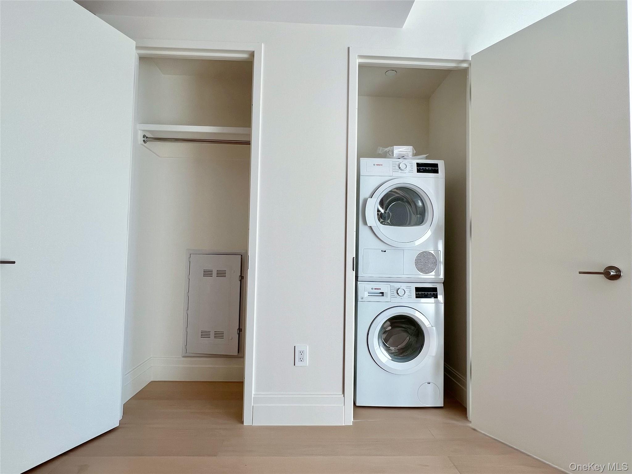 30-55 Vernon Boulevard, Unit 6G Queens, NY 11102 - Photo 12 of 16 a utility room with dryer and washer