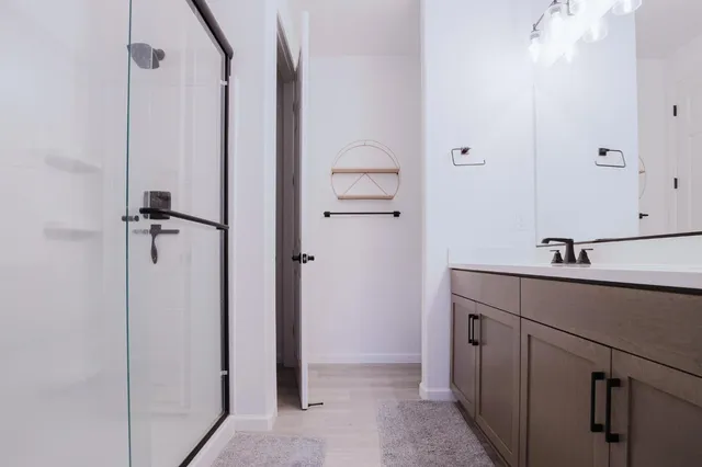 a bathroom with a sink and mirror