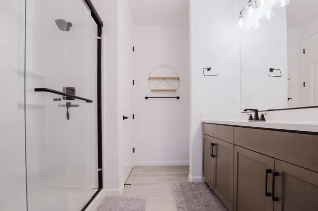 a bathroom with a sink and mirror