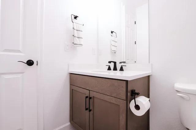 a bathroom with a sink and mirror