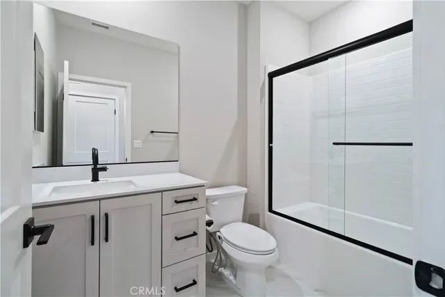 a close view of a utility room with dryer and washer